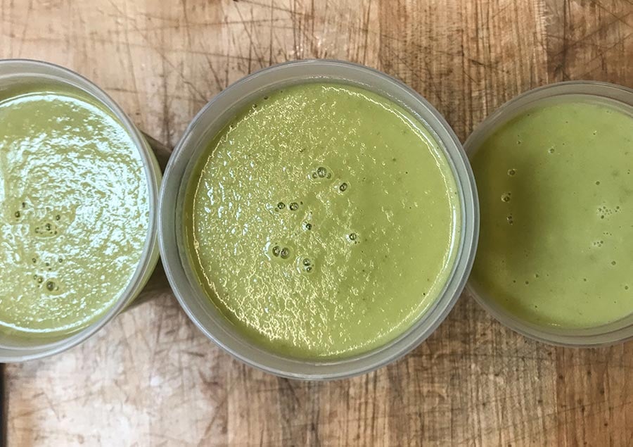 Creamy Texas Green Salsa in plastic containers.