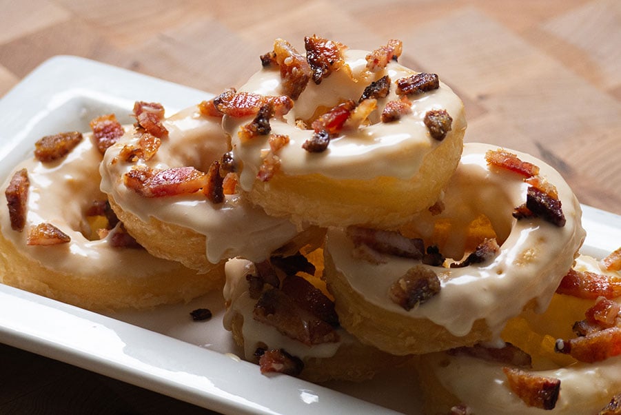 Tower of Maple Cronuts covered in candied bacon