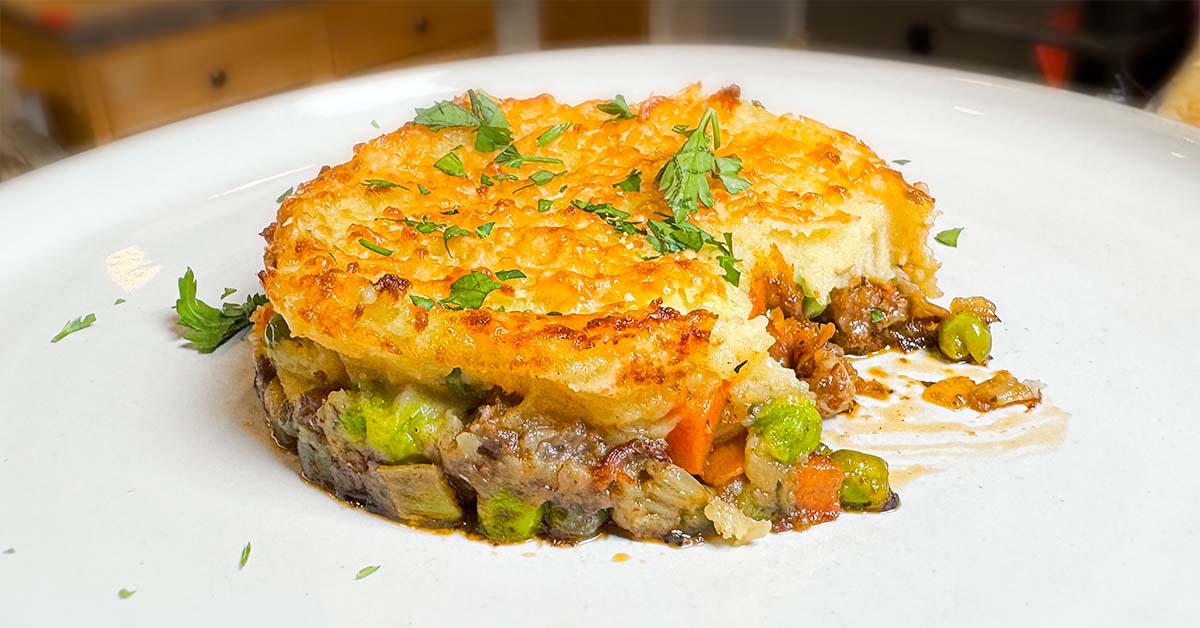 Shepherds pie with a couple bites taken out.