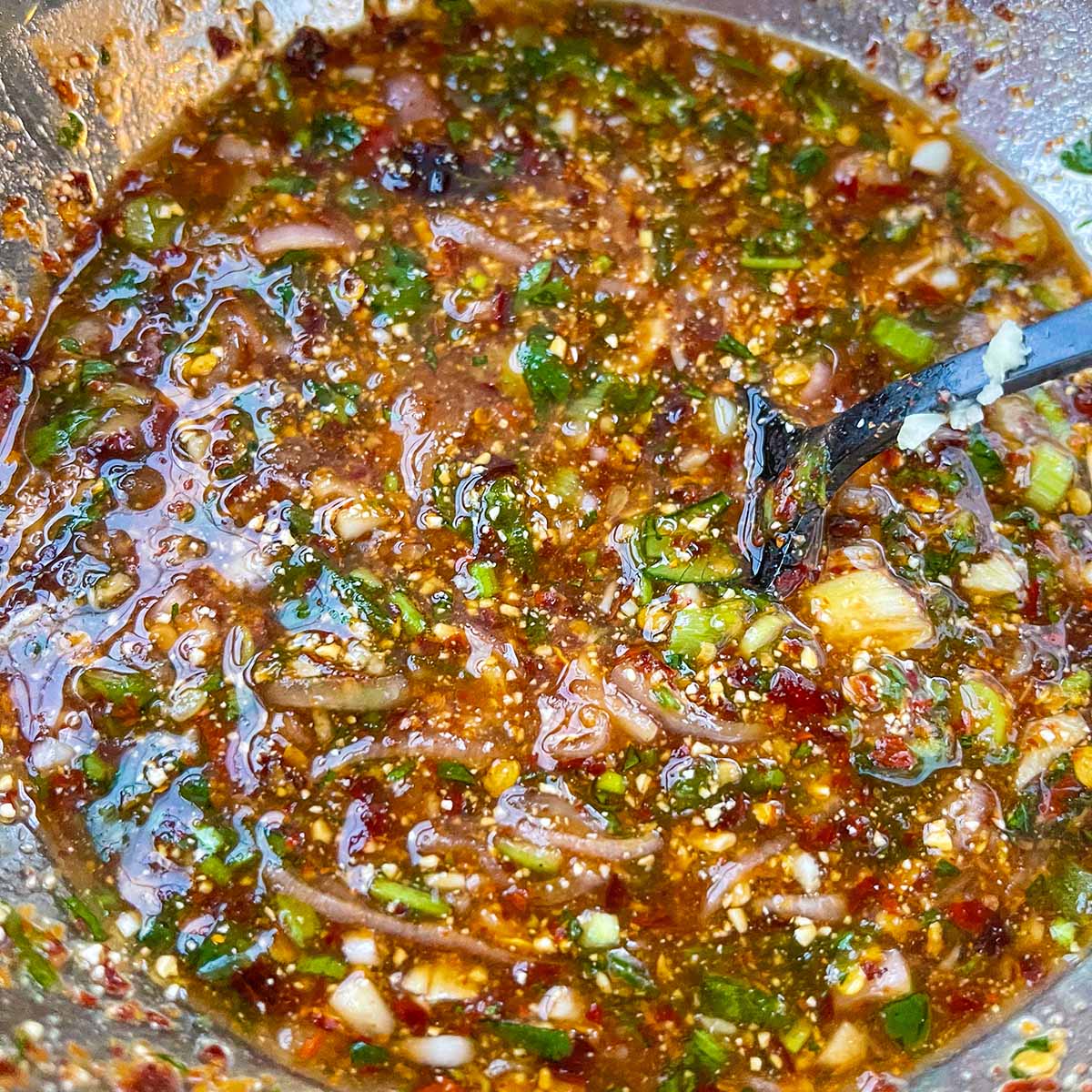 A bowl of Nam Jim Jaew grilling sauce.